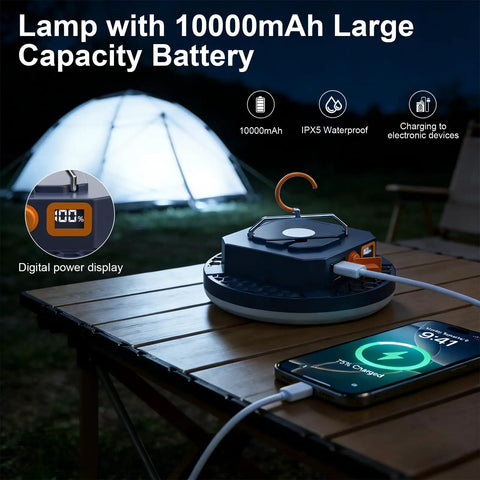 Crazy Bright 4000 Lumen Portable LED Camping Lantern With Digital Display And 30W Power charging phone on a table next to a tent