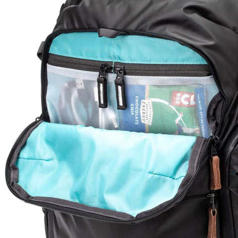 Explore V2 30 Starter Kit Camera Backpack open pocket showing interior storage compartments.
