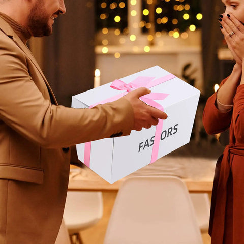 Man handing over a gift box labeled 'FASORS' with pink ribbon, suitable for storing Pink Tool Set 218-Piece Home Improvement Kit For Women