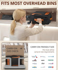 Woman placing Lightweight 20 Inch Softside Carry On Luggage With Four Spinner Wheels into overhead bin, showing fit and size check guide.