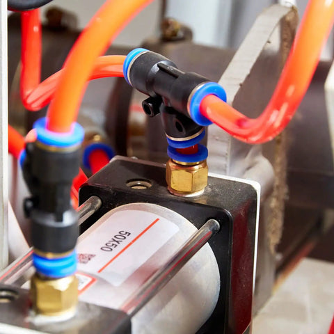 Close-up of Two Pack One Quarter Inch G Male Push Lock Fittings Tee Union in pneumatic system with 8mm tubing connectors.