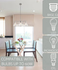 Whitney 27 Inch 5 Light Modern Farmhouse Chandelier with Conic Clear Glass Shades in brushed nickel over dining table.