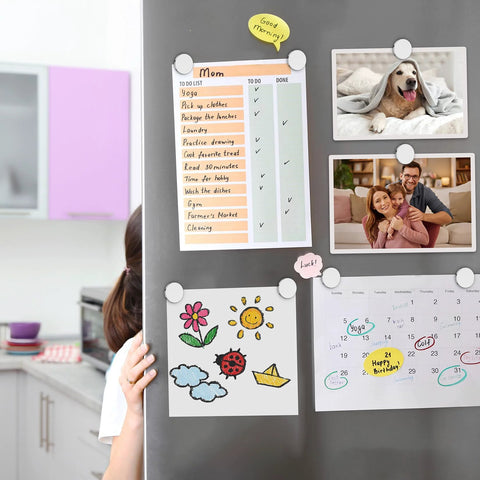 FINDMAG 4-pack neodymium disc magnets with double-sided adhesive; white discs on fridge holding photos and a to-do list