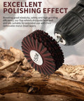 Close-up of 150 grit nylon abrasive flap wheel with 1/4 inch shank attached to a drill, shown polishing wood surface.