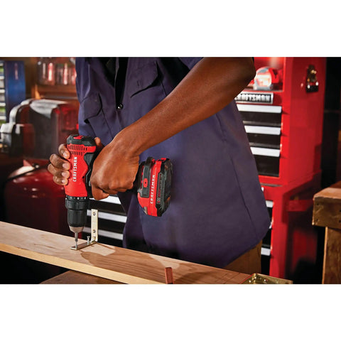 Person using V20 Cordless Drill And Driver Kit With One Half Inch Chuck Battery And Charger Included High Output 320 Watts