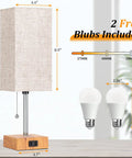 Set Of 2 Wood Table Lamps For Bedroom With 3 Color Modes Warm White Soft White Daylight White Pull Chain Nightstand Lamps With AC Outlets Compact Bedside Lights With 2 Bulbs For Living Room Kids Room Office Decor, one lamp with dimensions in inches and 2 included bulbs shown against a blurred background.