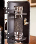 Interior view of Disguised As A Realistic Fire Extinguisher Mini Bar showing shot glasses and bottle holder.