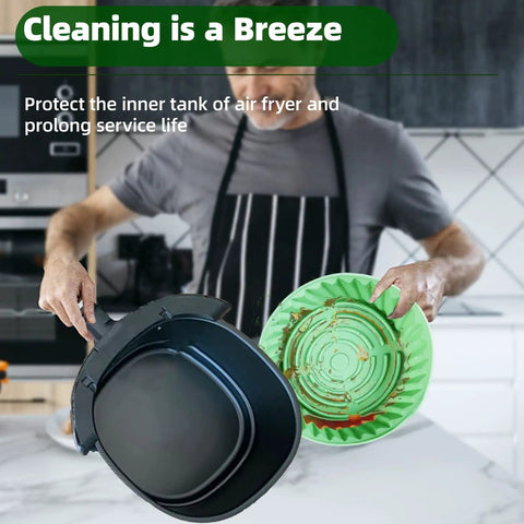 Man holding air fryer with 2 Pack Air Fryer Silicone Liners Reusable Liners For 5 Qt And Up Square Or Round Air Fryer Accessories