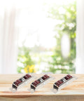 Top Shelf Stainless Steel Sash Wheels For Silky Smooth Sliding Windows And Patio Doors Heavy Duty Double Roller Pulleys set of four on wooden surface.