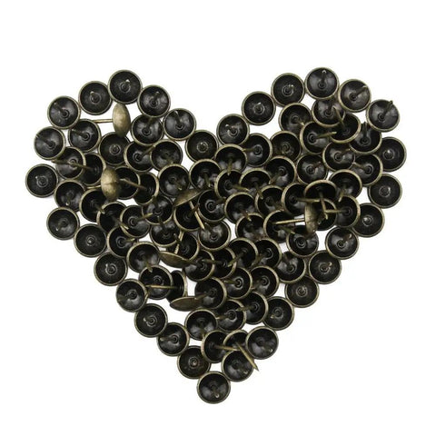 Top Shelf 100 Piece Set Of Antique Bronze Upholstery Nails And Decorative Furniture Tacks in heart shape layout.