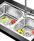 Double Bowl Kitchen Sink Protector Grid 304 Stainless Steel Universal Kitchen Sink Grid Bottom Rack Guard Keeps Your Sink Scratch Free Centered Drain 13.2 x 11.6 x 1.25 Inches Rubber Feet 2 Pack in use with vegetables and fruits.