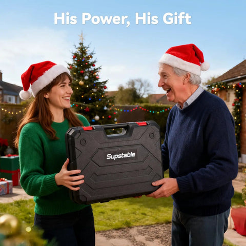 Two people exchanging gift box outdoors during Christmas