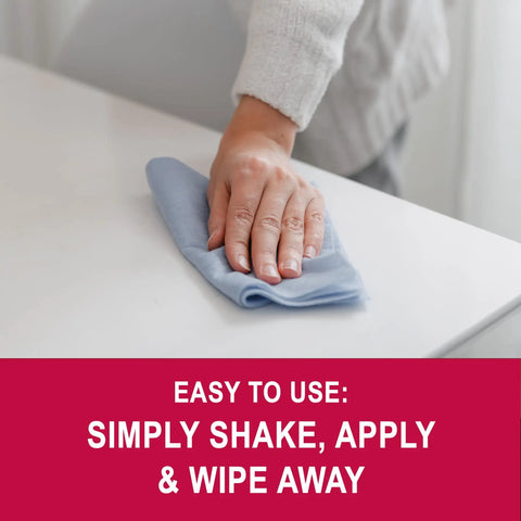Hand wiping surface with cloth using OZ Cream Polish One Quart For Cleaning And Polishing And Preserving Surfaces In One Easy Application Anti Static Dust Repellent Great For Wood Furniture Venetian Blinds Bathroom Fixtures And Other Smooth Surfaces