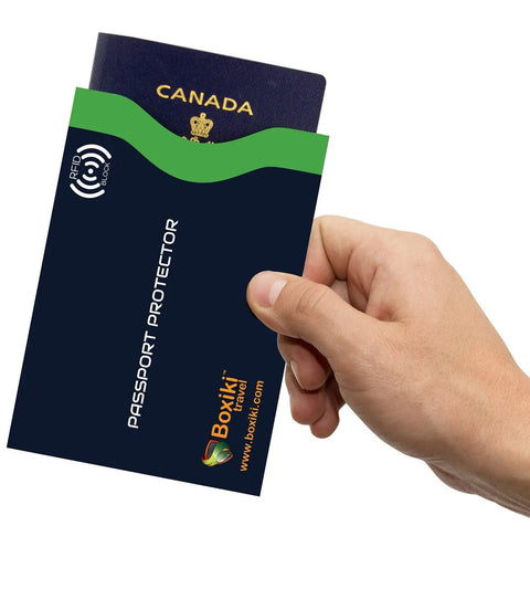 Hand holding navy RFID Blocking Travel Sleeves Set With Color Coding Navy Blue Unisex Wallet Keeps Your Cards And Passports Safe From Skimming And Identity Theft While On The Go passport sleeve