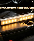 Pack Of Three Motion Activated Rv Step Lights With 10 Bright Leds And Instant Trigger on a car center console showing size.