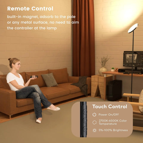 Woman using remote with Game-Changing LED Floor Lamp With Remote Control, Dimmable 3500 Lumen 36W Standing Torch Style Light in living room.