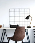 Industrial Luxe 17 Inch Desk Lamp in Matte Black with Antique Brass accents on home office desk with typewriter.