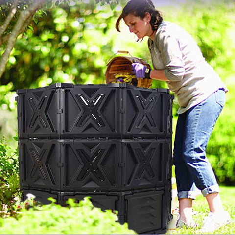 Woman using 540L Outdoor Tumbler Compost Bin For Garden And Yard, Extra Large BPA Free All Season Composting Box in backyard.