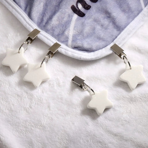 Star-shaped tablecloth weights with stainless steel clips from 10 Pack Marble Tablecloth Weights With Clips, Heavy Duty Stainless Steel Pendant Stone Hangers, Table Cover Clamps For Outdoor Picnics, Parties, And Family Dinners