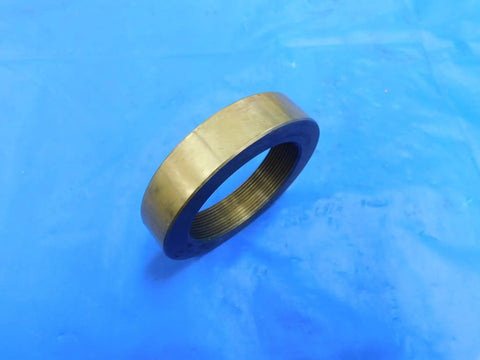 Top Shelf 2 Inch 20 Thread Brass Ring Gauge Nut Spacer For Precision Calibration And Machine Shop Work Built Sick Tight With Smooth Finishes For Heavy Duty Tasks Real Deal Engineering MH3938LVR on blue background.