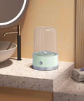 Compact Portable Washer For Delicate Laundry With Three Spin Settings Quiet Eco Friendly Design Featherweight Build Perfect For Dorm Digs Apartment Life Weekend Road Trips And Daily Freshening Up Green Finish on a countertop.