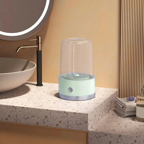 Compact Portable Washer For Delicate Laundry With Three Spin Settings Quiet Eco Friendly Design Featherweight Build Perfect For Dorm Digs Apartment Life Weekend Road Trips And Daily Freshening Up Green Finish on a countertop.