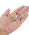 Hecka Durable M8 Flat Washers Set Of Twenty Thickened 304 Stainless Steel Spacers With Burr Free Edges in a hand showing ten pieces.