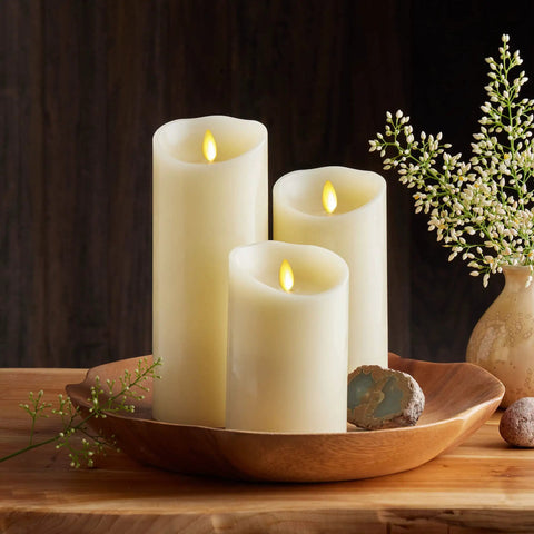 Cozy Ivory Flameless LED Pillar Candle With Moving Flame 3.5 By 5 Inch Real Wax Look Battery Operated Timer in wooden bowl display