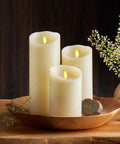 Set of ivory Scalloped Edge Flameless LED Pillar Candle 3.5 By 8.75 Inches on wood tray, real wax look, moving flame, cozy decor