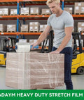 Person using Heavy Duty Stretch Film Shrink Wrap Roll Pack Five Inch By Twelve Hundred Feet Eighty Gauge With Six Hundred Percent Stretch