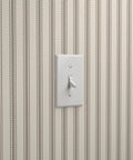 Straight Up Rustic Farmhouse Vinyl Wallpaper With Kickass Leather Texture Heavy Duty Type II Wallcovering, light switch against striped wallpaper.