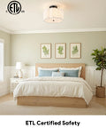 Three Light Semi Flush Mount Ceiling Light Fixture In Black Finish With White Fabric Drum Shade For Kitchen, Bedroom, And Living Room, Modern Home Lighting For Contemporary And Mid Century Decor illuminating a bedroom.
