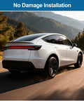 Precision Fit No Drill Rear Trunk Spoiler For Tesla Model Y Juniper 2025 2026 Upgrade with sleek design on a road.