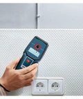 Heavy Duty Digital Stud Finder Wall Scanner With Killer Precision Detection For Wood Copper Pipes Metal And PVC Cavity Scan featuring a hand using the device on a wall surface.