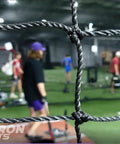 Inside a Fully Enclosed Baseball Softball Batting Cage Net With Easy Entry Door Built Tough For All Weather, players practicing
