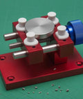 Beefy Aluminum Work Holder With Anodized Red Finish And Knurled Blue Adjustment Knob A Solid Workshop Tool For Securely Holding Parts And Precise Repairs Heavy Duty Aluminum Alloy Build For Everyday Shop Use, red aluminum work holder with blue knob