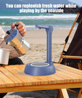Electric Water Dispenser For 1 To 5 Gallon Bottles With Adjustable Stand on a wooden table by the beach