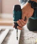 Person using a drill to install a M2x8mm Hex Socket Head Cap Screw Self Tapping Set 304 Stainless Steel Black Oxide Hex Drive.
