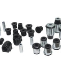 Front And Rear Suspension Bushing Kit For Ford F-150 09-13 with black and silver bushings and sleeves laid out.