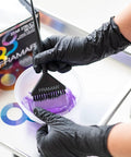 Person applying purple dye wearing Powder Free Nitrile Gloves 12 Inch Pro Grade Extra Durable Black Disposable Latex Free