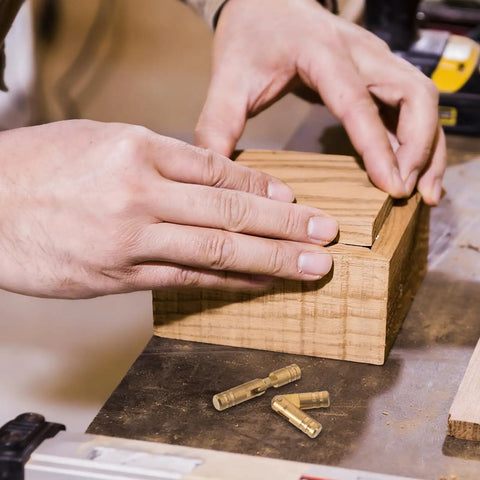 Hands fitting a wood box lid with Beefy Heavy Duty Brass Cylinder Invisible Hinges Set 10 Pieces, 5mm Thick Fixed Concealed Barrel Hinges.