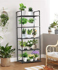 Five Tier Storage Rack For Kitchen And Laundry Room Height Adjustable Microwave Cart Rock Solid Steel Frame with potted plants.