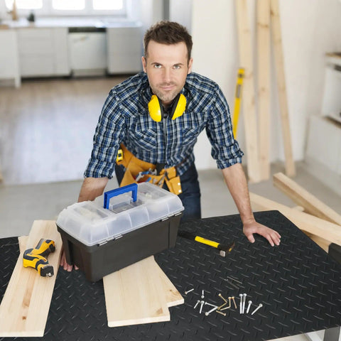 Man using non slip 2mm thick work bench pad 48 by 17 inch textured PVC mat for woodworking DIY garage and tabletop protection.