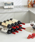 Totally Game Changer Stackable Water Bottle Organizer For Cabinet Storage, Clear Tumbler Holder That Takes 32 Oz Bottles And Energy Drinks, Saves Gobs Of Pantry Space While Keeping Your Setup Looking Fresh And Neat. Transparent bottle holder display with six stacked wine bottles on countertop.