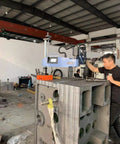 Man using the Heavy Duty Magnetic Base For SFX M24HR M30R M36R Electric Tapping Machine with 1000Kg hold in workshop.