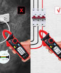 Person using Compact Clamp Meter With Alligator Clips For AC And DC Current, True RMS 2000 Counts on wiring panel