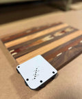 Must Have Cutting Board Foot Jig For Woodworking That Delivers Fast Precise Marking Drilling Or Punching One Eighth Inch Holes With A Heavy Duty 7mm Phenolic Locating Plate Built To Last on a wooden surface