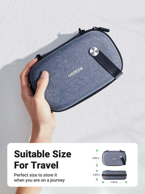 Rugged Hardshell Tech Organizer Travel Case Packs All Your Fresh Gadgets Square With Nifty Double Layer Pouch For Cables Chargers And Memory Cards In Sleek Space Grey held in hand.