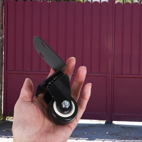 2 Inch Swivel Caster Wheels With Side Mount Hardware Glides Smooth As Butter For Cabinets Drawers And Shop Carts Quiet Polymer Rollers Built Tough To Last held in a hand.