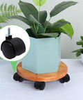 1 Inch Stem Swivel Casters Set Of 4, M6 Threaded Stem, 360 Degree Rotation installed on a plant stand for quiet rolling, black.